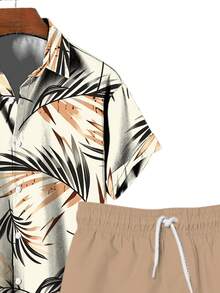 Bộ đồ nam phong cách Hawaii gồm áo thun in hình lá cọ và quần short có dây rút, thoải mái và năng động. - Nhiều màu - Xem 2