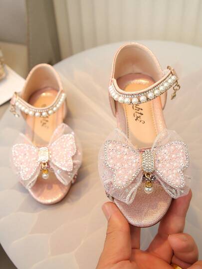 Sandal đế bằng cho trẻ em, đính nơ, ngọc trai và đá lấp lánh, cỡ lớn, vừa và nhỏ, dành cho bé gái.