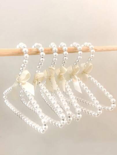 1 Peça/Cor Selecionável Elegante Cabide de Estimação Falso de Pérola com Laço de Fita, Cabide de Roupas de Plástico Fofo em Miniatura para Cachorros, Gatos, Pequenos Animais de Estimação, Brinquedos de Pelúcia - Acessórios de Vestuário de Estimação com Decoração de Pérola, Cabide de Estimação para Cães Pequenos