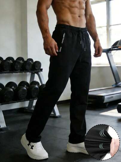 Quần thể thao nam bằng lụa băng thoáng mát, thiết kế dây rút co giãn cao, phù hợp cho tập thể dục, tập luyện buổi sáng, thể thao ngoài trời, màu đen mùa xuân.