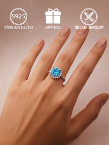 Anel feminino geométrico em prata de lei S925, com zircônia cúbica azul redonda cravejada em pavé, tamanho ajustável, ideal para uso diário ou para presentear, perfeito para noivado. Acompanha caixa para presente. - Prata - Ver 7