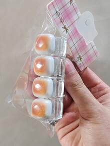 1个焦糖面包造型钥匙扣，可作为减压玩具、机械键盘测试器、钥匙扣、桌面装饰、手机挂饰和创意可伸缩玩具。 - 彩色 - 查看 9