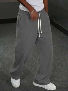 Quần thể thao nam kiểu dáng thường ngày này có thiết kế ống đứng rộng rãi, lót giữ nhiệt tạo cảm giác thoải mái và mềm mại. Phù hợp cho cả mặc trong nhà và ngoài trời, đây cũng là món quà tuyệt vời dành cho các cặp đôi. Quần được làm từ 100% vải polyester và có dây rút ở eo để điều chỉnh độ vừa vặn, có nhiều màu sắc để lựa chọn. - Màu xám đen - Xem 8
