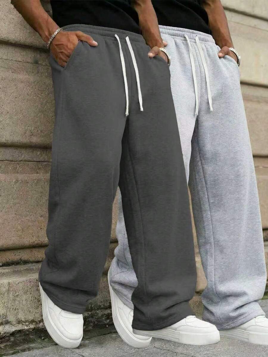 Quần thể thao nam kiểu dáng thường ngày này có thiết kế ống đứng rộng rãi, lót giữ nhiệt tạo cảm giác thoải mái và mềm mại. Phù hợp cho cả mặc trong nhà và ngoài trời, đây cũng là món quà tuyệt vời dành cho các cặp đôi. Quần được làm từ 100% vải polyester và có dây rút ở eo để điều chỉnh độ vừa vặn, có nhiều màu sắc để lựa chọn. - Màu xám đen - Xem 1