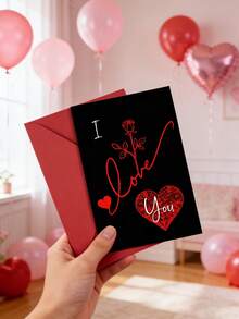 Elegant Valentine's Day Greeting Card With Red Rose Motif: Express Love, Passion & Romance​ – Features A Sleek Black Background With Striking Red Cursive "I Love You", Accompanied By A Delicate Red Rose And Intricate Heart Patterns. The Card Measures 17.8cm*12.7cm/7"*5" And Comes With A Matching Red Envelope. - Single Piece - View 3