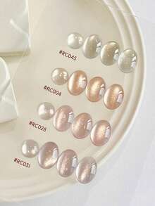 2026春夏新款女士节日礼盒套装，容量15毫升，包含闪亮浅金色、风铃半透明猫眼裸粉色、裸紫色、香槟色、猫眼紫金色、粉红日记蜜桃猫眼、玻璃珠水晶石猫眼凝胶指甲油。适合四季美甲和美容。 - 彩色 - 查看 4