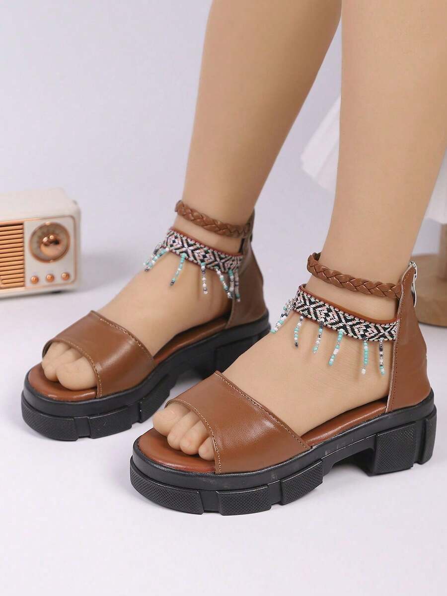 1 đôi sandal cao gót thời trang bằng da PU cho bé gái, kiểu dáng trơn màu, có tua rua, phù hợp với phong cách đường phố sành điệu của các bé gái, sandal cao gót thời trang. - màu nâu - Xem 1
