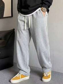 男士休闲运动裤，宽松直筒版型，舒适垂坠，适合居家休闲和户外活动。也可作为情侣礼物。采用100%涤纶面料，配有抽绳腰带，可调节松紧，多种颜色可选。 - 灰色 - 查看 8