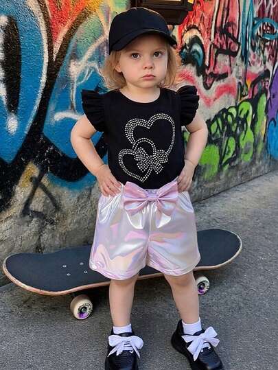 Set de 2 piezas de conjunto casual, de moda y lindo para niñas: Camiseta sin mangas suave y cómoda con estampado de corazón y lazo, shorts de cintura elástica con decoración de lazo, adecuado para uso diario de verano, fiesta, vacaciones y actividades al aire libre