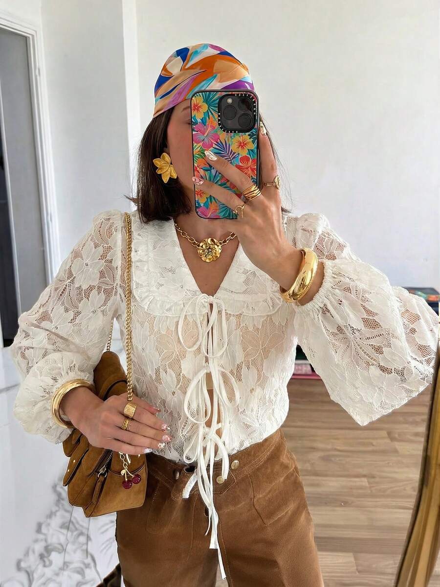 Áo kiểu nữ HoloChill 2026 mới, phong cách trẻ trung, năng động, màu trơn, phối ren jacquard, thắt nơ phía trước, tay dài, cổ Peter Pan, chất liệu co giãn, hơi xuyên thấu, thích hợp mặc mùa hè, trang phục mùa xuân cho nữ, áo dự tiệc ngày lễ cho nữ, trang phục đi biển cho nữ, áo hè thanh lịch cho nữ. - trắng - Xem 1