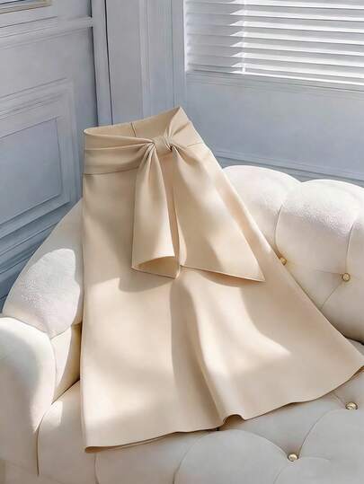 女士休闲优雅百搭纯色高腰A字直筒中长裙，正面蝴蝶结侧拉链细节设计，春夏款