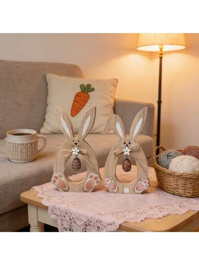 2 stuks holle houten konijnenbeeldjes (met touw en versierde eieren, een klassiek paassymbool), geschikt voor paasfeesten, huisdecoratie en het creëren van een lenteachtige sfeer. Met hun holle konijnensilhouet en versierde eieren vormen ze de kern van de decoratie en dragen ze bij aan de warme paassfeer. Ze zijn perfect voor paasfeesten, lentedecoraties in huis en het creëren van een feestelijke sfeer.