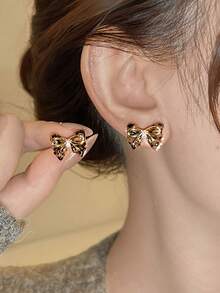 1 par de pendientes de botón con lazo de strass delicados - color café - Ver 1