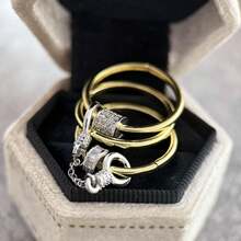 1枚全新时尚设计链式混搭金属戒指，镶嵌立方氧化锆，时尚百搭，男女皆宜。适合日常佩戴、派对、音乐节、生日、情人节等场合，也是一份贴心的珠宝礼物。 - 金色 - 查看 3