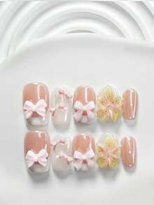 10件套可爱多功能凝胶美甲套装，包含亚克力美甲贴纸、粉色蝴蝶结、手工制作的五瓣渐变黄粉花朵美甲装饰、白色指甲油，以及美甲工具（1个果冻贴纸+1个指甲锉）。提供三种形状：方形、杏仁形、短长方形。适合女性日常通勤、旅行、派对美甲装饰。手工制作的按压式美甲贴片。 - 彩色 - 查看 12