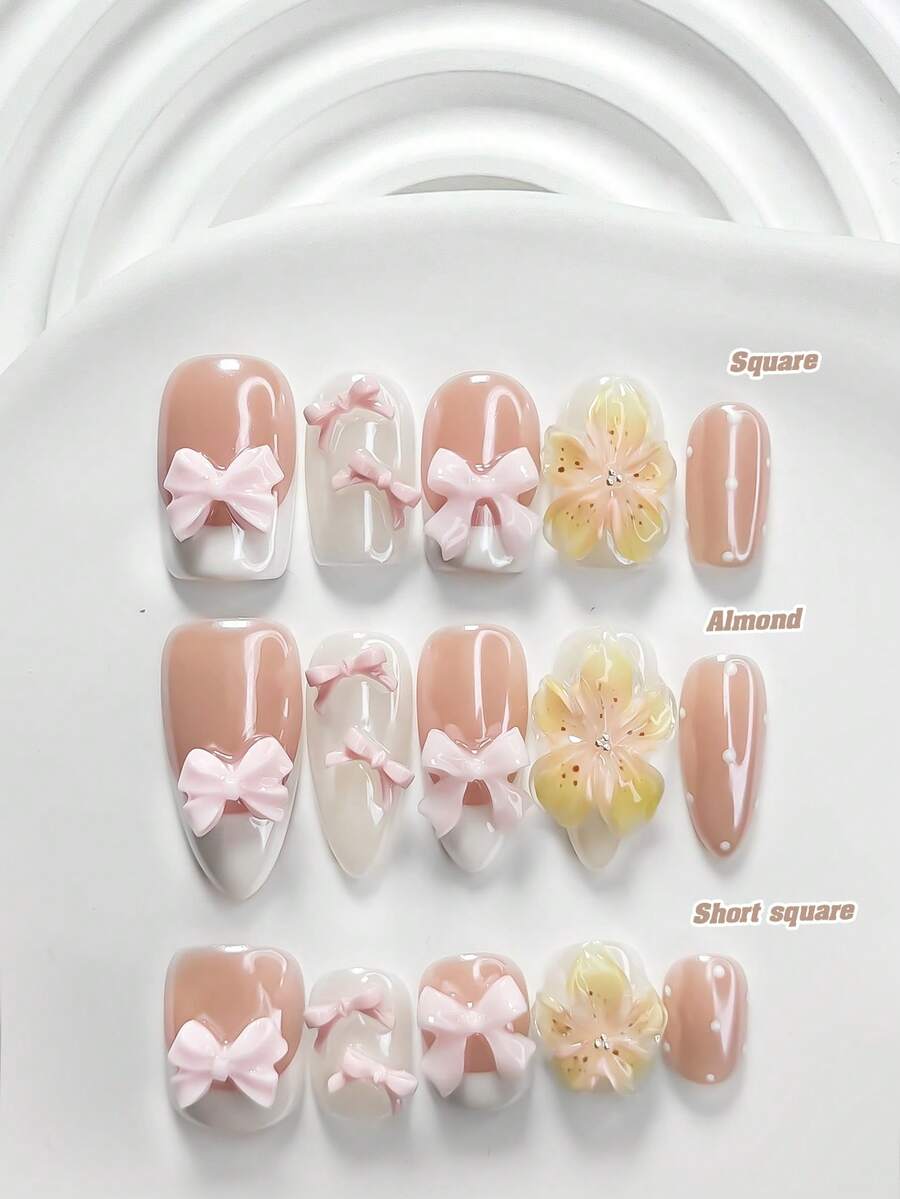 10件套可爱多功能凝胶美甲套装，包含亚克力美甲贴纸、粉色蝴蝶结、手工制作的五瓣渐变黄粉花朵美甲装饰、白色指甲油，以及美甲工具（1个果冻贴纸+1个指甲锉）。提供三种形状：方形、杏仁形、短长方形。适合女性日常通勤、旅行、派对美甲装饰。手工制作的按压式美甲贴片。 - 彩色 - 查看 1