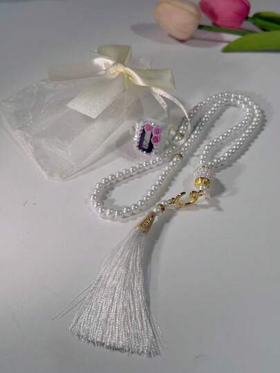 三件套：水钻花朵戒指计数器 + 99颗珍珠流苏念珠 + 精美蝴蝶结礼品袋。可定制，经久耐用，适合作为开斋节礼物。多种颜色可选，男女通用设计，可用于祈祷计数、仓库计数、运动追踪、钓鱼、娱乐游戏等。