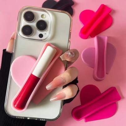 Soporte de teléfono en forma de corazón de silicona 2 en 1 y soporte para brillo labial, soporte de teléfono adhesivo lindo compatible con todos los teléfonos inteligentes, visualización sin manos y almacenamiento de brillo labial, antideslizante y anti caída, regalo práctico para la novia, Día de San Valentín