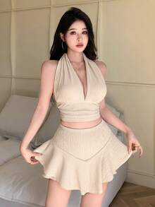 杏色性感深V领露背系带短款上衣搭配荷叶边迷你裙和短裤，休闲通勤两件套，提花面料，适合年轻时尚女孩，新款春夏海滩度假装 - 米杏色 - 查看 7