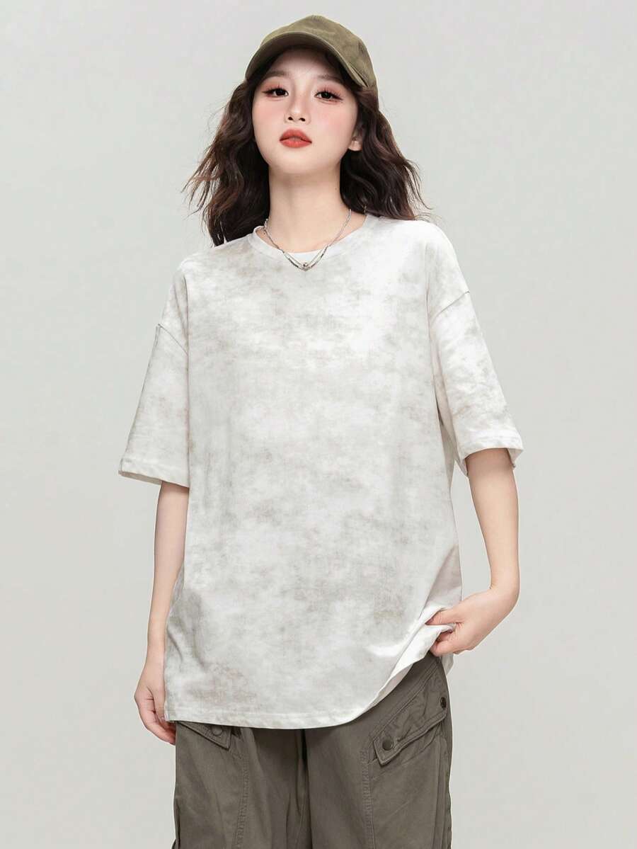 Camiseta holgada de cuello redondo blanca con estampado floral irregular de JUTU para primavera/verano, nueva blusa casual de manga corta versátil y de largo medio para mujeres - 0A11 Blanco roto - Ver 1