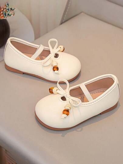 1 par de mocasines planos con decoración de lazo de perlas para niñas, suela suave antideslizante, zapatos de estilo princesa coreano, adecuados para todas las estaciones