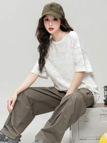 Camiseta holgada de cuello redondo blanca con estampado floral irregular de JUTU para primavera/verano, nueva blusa casual de manga corta versátil y de largo medio para mujeres - 0A11 Blanco roto - Ver 6