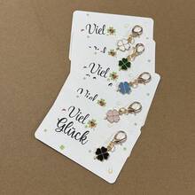 幸运四叶草钥匙扣，附赠“Geschunken Ist Glueck”（送礼即好运）幸运卡——吉祥护身符，适合圣帕特里克节、生日、考试、婚礼、毕业典礼等场合——传递好运祝福的积极礼物 - 彩色 - 查看 6