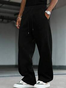 Quần thể thao nam màu trơn, có dây rút ở eo và túi, dáng rộng, màu xám. - màu đen - Xem 4