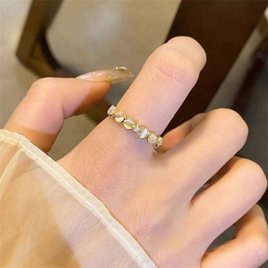 Một chiếc nhẫn opal hình ngôi sao kiểu Pháp, một chiếc nhẫn nhỏ nhắn dành cho nữ với thiết kế hở, mang đến phong cách sang trọng, nhẹ nhàng, phù hợp với mọi dịp. - Nhiều màu - Xem 1