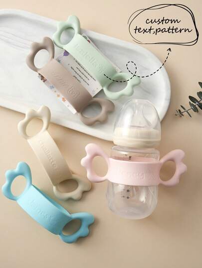 1pc Personalized Customization Debossed Name And Pattern Wings Silicone Baby Bottle Cover Lightweight Baby Bottle Handle Grip Sleeve With Partial Protection, Anti-Slip Design For Bottles And Water Cups Childern Essentials Gifts