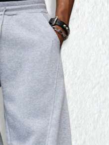 男士休闲裤，宽松阔腿户外运动裤，采用基础款弹力腰带和口袋设计。适合健身、户外徒步和返校穿着。 - 淺灰色 - 查看 5