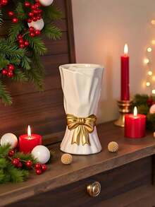 Ten biały ceramiczny wazon z kokardą to doskonały wybór do wystroju domu. Jest w stylu boho, duży i idealnie nadaje się do postawienia na półkach, stołach lub w salonie. Nadaje się również jako prezent urodzinowy, walentynkowy lub na Dzień Matki. - Wielokolorowe - Zobacz 9