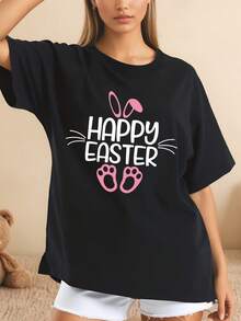 Diseño de conejo con orejas y patas rosadas Happy Easter camiseta negra estilo holgado con estampado divertido para mujeres ocasión casual festiva 220g - Negro - Ver 1