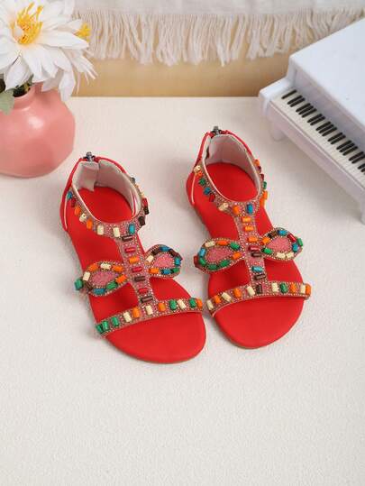 A Pair Of The Latest Summer Style Bohemian Crystal-Dazzling Roman Sandals For Children - In Red Design. It Is An Excellent Choice For Daily Outings, Shopping In Malls, Summer Vacations, Party Events, And Park Walks. It Can Be Easily Matched With Various Children's Outfits, Featuring A Casual, Fashionable And Comfortable Style.