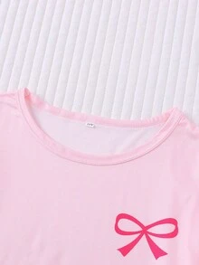 Bộ đồ ngủ ngắn tay in họa tiết sọc và nơ cho trẻ em, gồm áo ngắn tay và quần short cạp chun rộng có bèo nhún, thích hợp cho trẻ em và thanh thiếu niên mặc thường ngày, đi nghỉ mát, dự tiệc. - Hồng - Xem 4