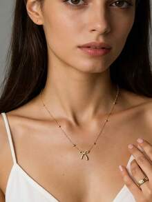 1. 精致甜美的蝴蝶结吊坠，搭配百搭项链，适合女性日常节日佩戴。可作为礼物送给朋友或爱人。 - 蝴蝶結項鍊 - 查看 2