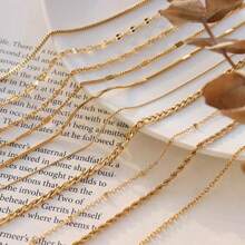 1条18K镀金钛钢项链，链子造型包括十字架、刀、蛇骨、O形、盒子、嘴唇、锤子、星星等，长度45+5厘米。 - 金色 - 查看 6