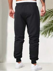 بنطلون رياضي كاجوال للرجال، تصميم أساسي بلون أحادي جديد، خصر مطاطي مع سحاب وجيوب، مربوط الكاحل، مناسب للرياضة الخارجية، الربيع والخريف - الأسود - مشاهدة 2