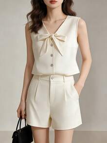 Conjunto de 2 piezas de verano con top corto con cuello en V y lazo en la parte delantera, y shorts plisados de línea A en unicolor elegante para mujer - Albaricoque - Ver 3