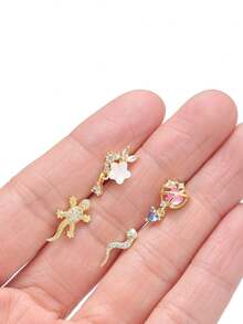 12 piezas Anillos de nariz en forma de L, con diseños de serpiente, mariposa, flor, luna y colgantes con circonita cúbica, para mujeres y hombres, en tonos plateado y dorado, 20G - Dorado - Ver 6