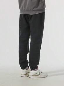 Nike Men's Fleece-Lined Warm Multi-Crotch Letter Knit Casual Sports Tapered Trousers - Black - View 4