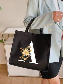 A-Z 花卉字母黑色帆布手提袋和化妆包套装，字母印花可重复使用购物袋搭配同款化妆包，适合携带日常必需品、杂货、化妆品和办公用品，是伴娘、学生、上班族和送礼佳品的理想之选，也适合日常出行、购物、婚礼和通勤等场合。 - 彩色 - 查看 3