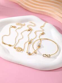 Set de 4 piezas de pulsera y brazalete de lujo con diseños de símbolo del infinito, flecha, pluma, strass y corazón, de diseño elegante, minimalista y de alta gama - Amarillo Oro - Ver 4
