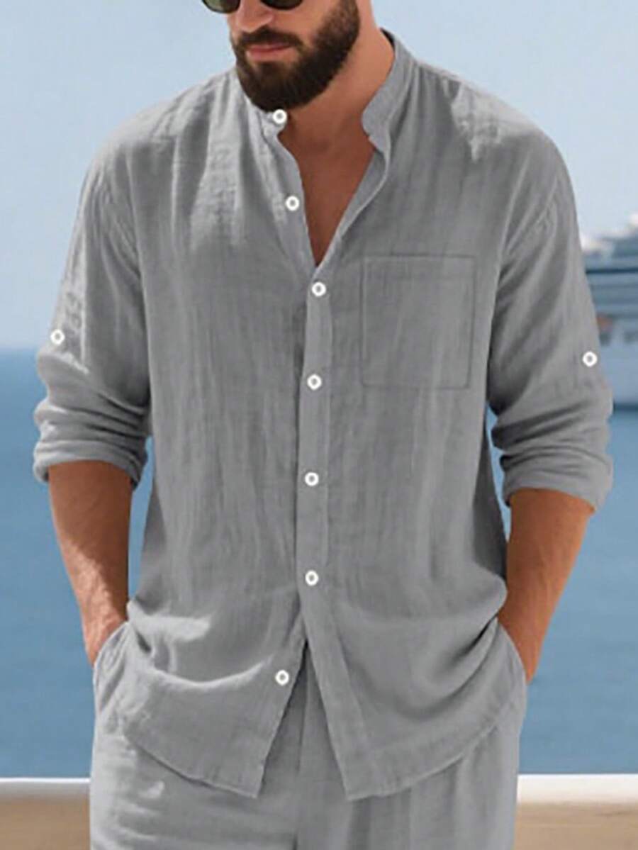 Men's Spring/Summer Linen Stand Collar Long Sleeve Shirt, Button Front Chest Pocket + Roll-Up Sleeve Design, Breathable & Stylish, Suitable For Beach Vacation & Casual Wear. Sizing Tips: Available In XS-XXXL, European Fit Tends To Be Loose, Recommend Sizing Down For A More Fitted Look; Lighter Color Fabrics Are Slightly Sheer, Choose Based On Styling Needs. - 淺灰色 - 查看 1