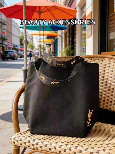 黑色帆布单肩包，极简高端风格，大容量，适合工作、购物、上学和旅行等场合。YSL帆布包