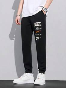 Nike Men's Fleece-Lined Warm Multi-Crotch Letter Knit Casual Sports Tapered Trousers - Black - View 2