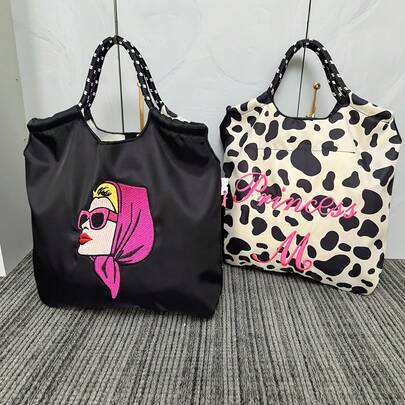 大容量可折叠尼龙手提包，饰有人头刺绣，单肩手提包