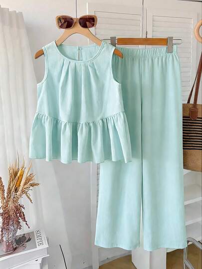 Bộ đồ mùa hè cho bé gái, kiểu dáng thường ngày tối giản: áo không tay cổ tròn dáng rộng màu trơn và quần ống rộng cạp chun màu trơn.