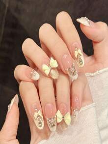 10 Stück nude rosa & milchig gelbe Schleifen Acryl Fake Nägel, nude rosa Farbverlauf Gold Glitzer Schmetterling Nail Art Aufkleber, kurze/lange ovale Kunstnägel, DIY Maniküre Zubehör, wiederverwendbar, inklusive Gelee Gel und Nagelfeile, geeignet für den täglichen Gebrauch, Valentinstag - Verschiedenfarbig - Übersicht 3