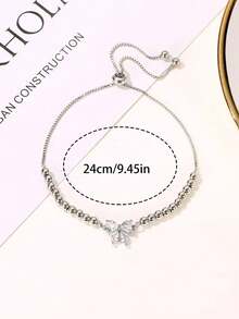 Bộ 2 chiếc đồng hồ nữ thời trang đa năng, mặt tròn, dây đeo bằng thép không gỉ, kèm vòng tay đính nơ đá quý, thích hợp làm quà tặng, quà ngày lễ và đeo hàng ngày. - Bạc - Xem 9
